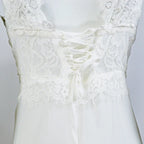 Open Back Floor Length Dress With Soft Structured Draping