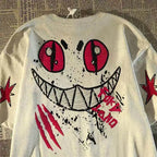 Oversized Graffiti Smile Graphic Cotton T-Shirt with Street Art Inspired Design