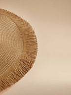 Oversized Woven Straw Sun Hat with Fringe Trim for Beach Travel and Resort Styling