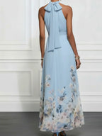 Ethereal Light Blue Halter Maxi Dress with Flowing Floral Print Hem