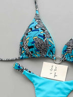 Mixed-Media Abstract Print and Turquoise String Bikini with Metallic Hardware
