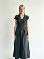 Elegant Short-Sleeve Smocked A-Line Midi Dress in Classic Black