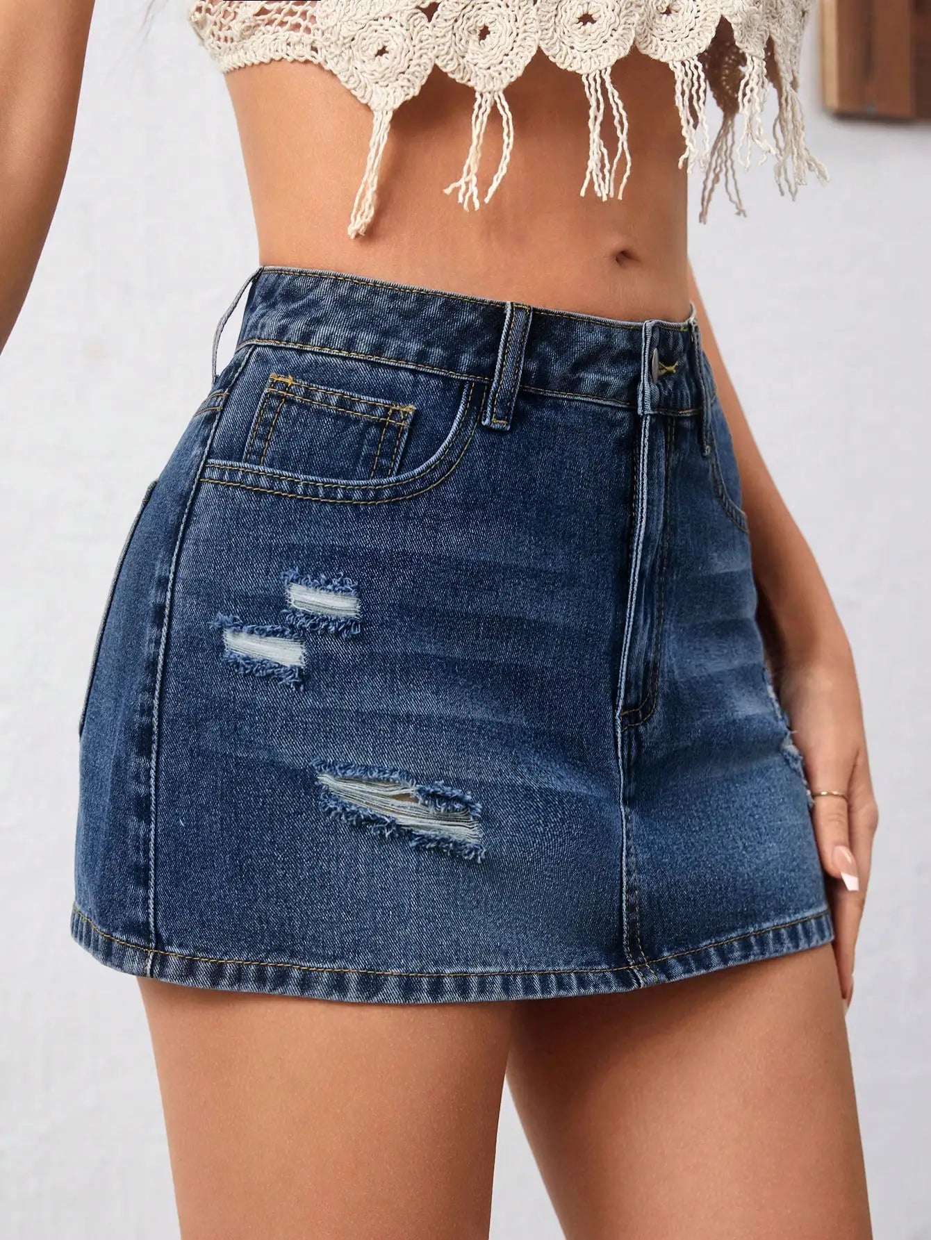 Distressed Denim Mini Skirt with Ripped Details and Streetwear Edge