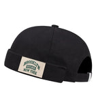 Minimalist Folded Cuffed Beanie with Woven Patch Detail for Contemporary Streetwear Fashion