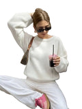 Women's Minimalist Crew Neck Knit Sweater with Relaxed Long Sleeve Silhouette