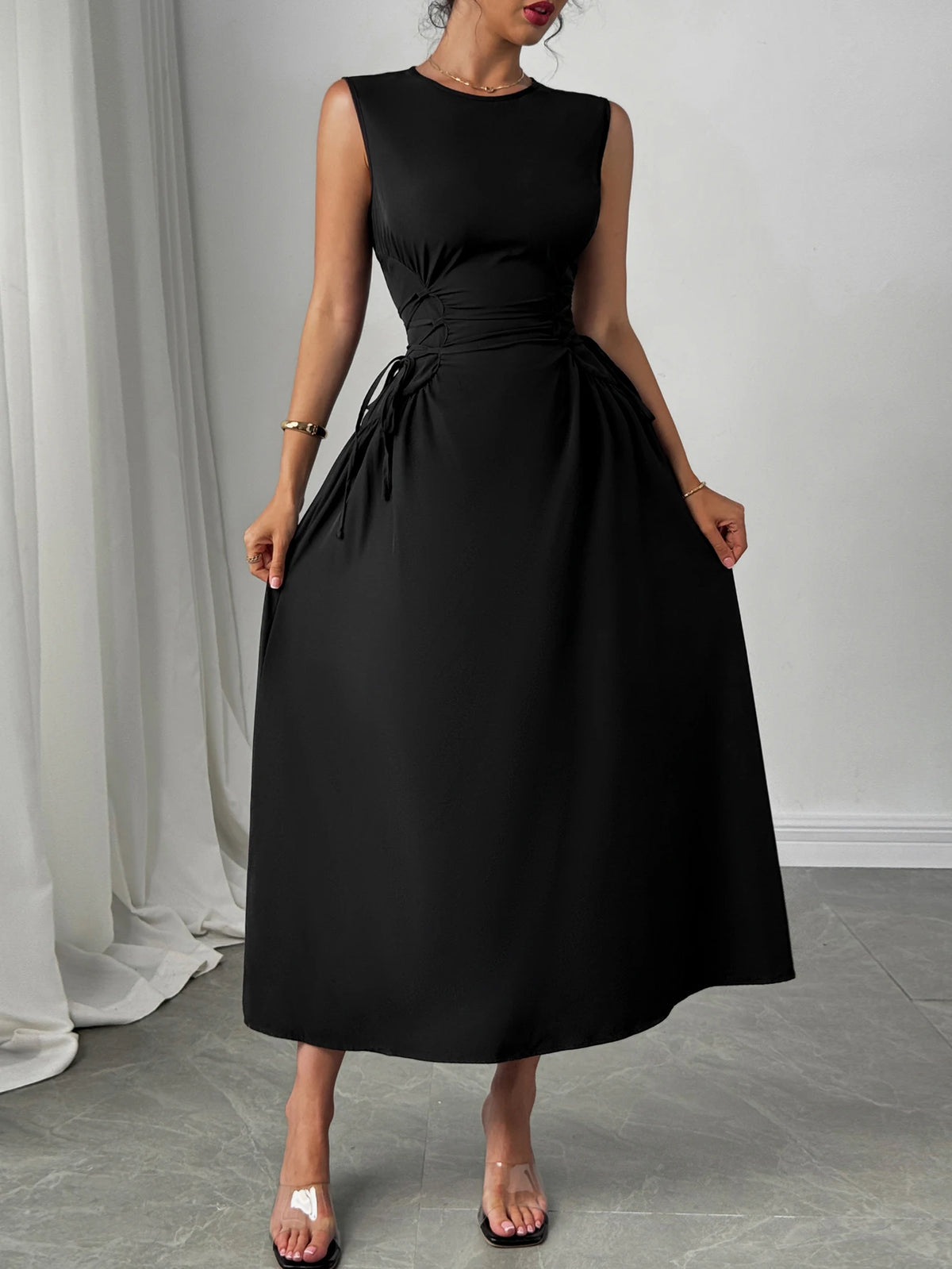 Minimalist Black Sleeveless A-Line Dress with Corset-Style Side Lacing Detail