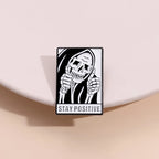 Stay Weird Skeleton Reader Gothic Enamel Pin for Alternative Fashion Styling