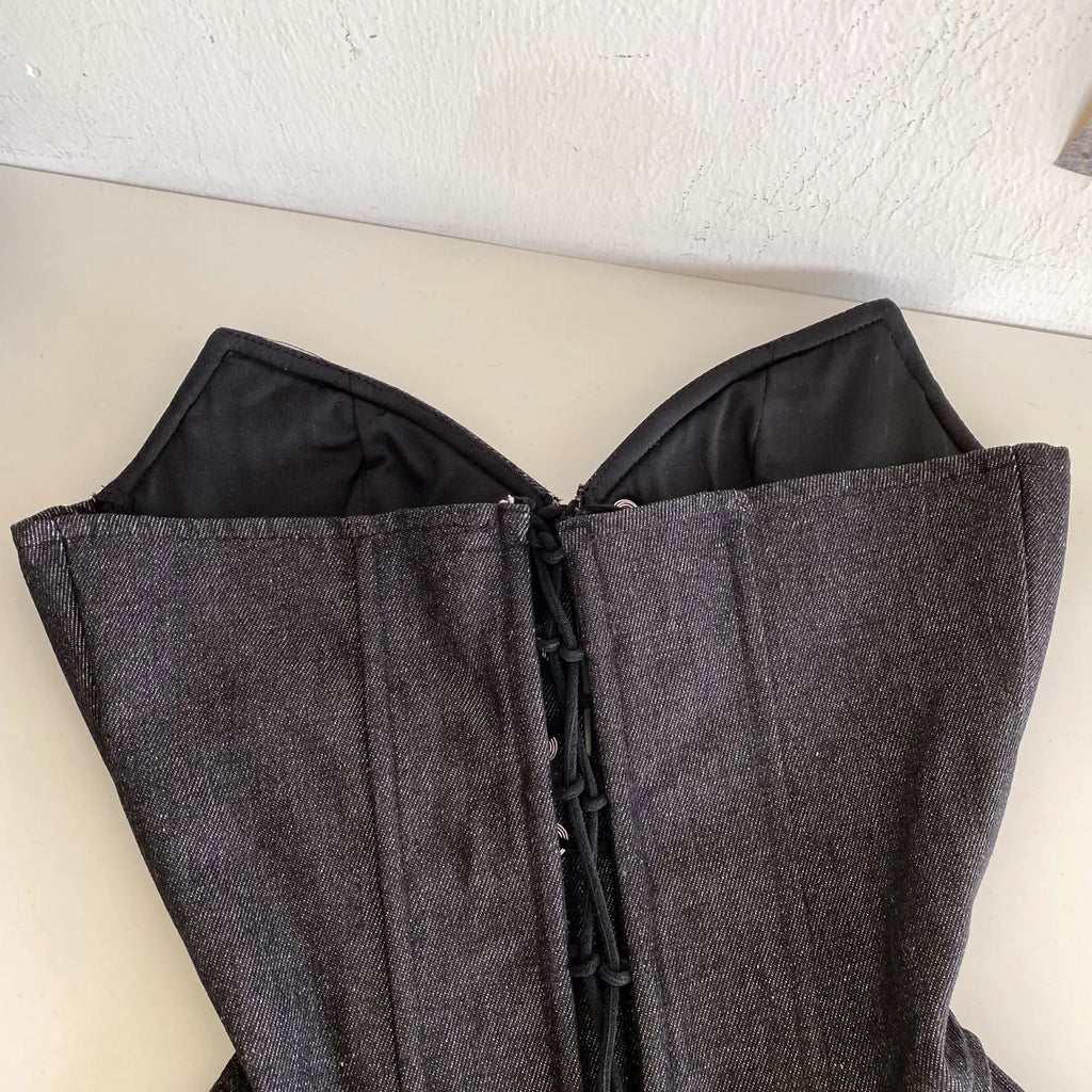 Dark Denim-Inspired Strapless Lace-Up Bustier with Asymmetrical Peplum Hem
