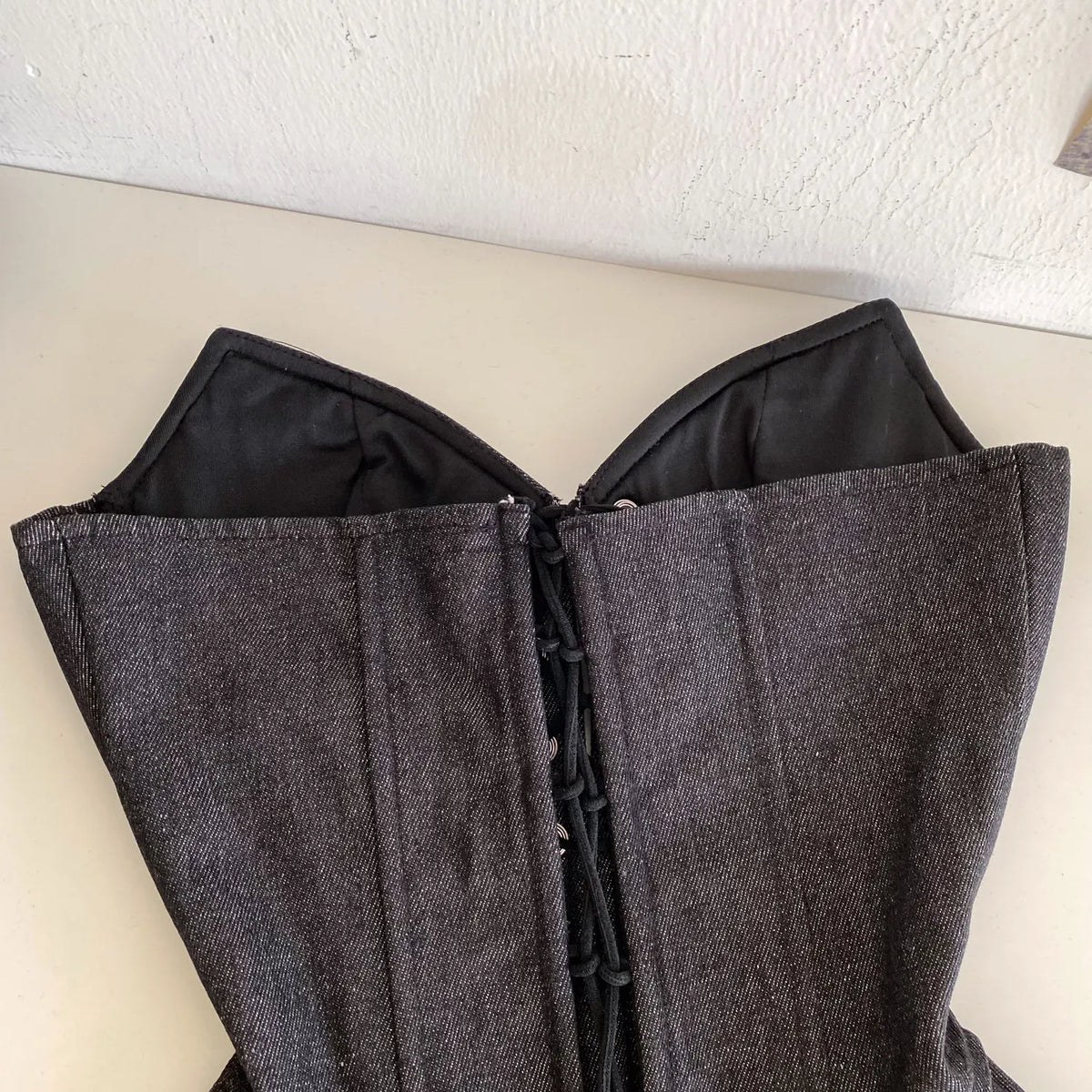 Dark Denim-Inspired Strapless Lace-Up Bustier with Asymmetrical Peplum Hem