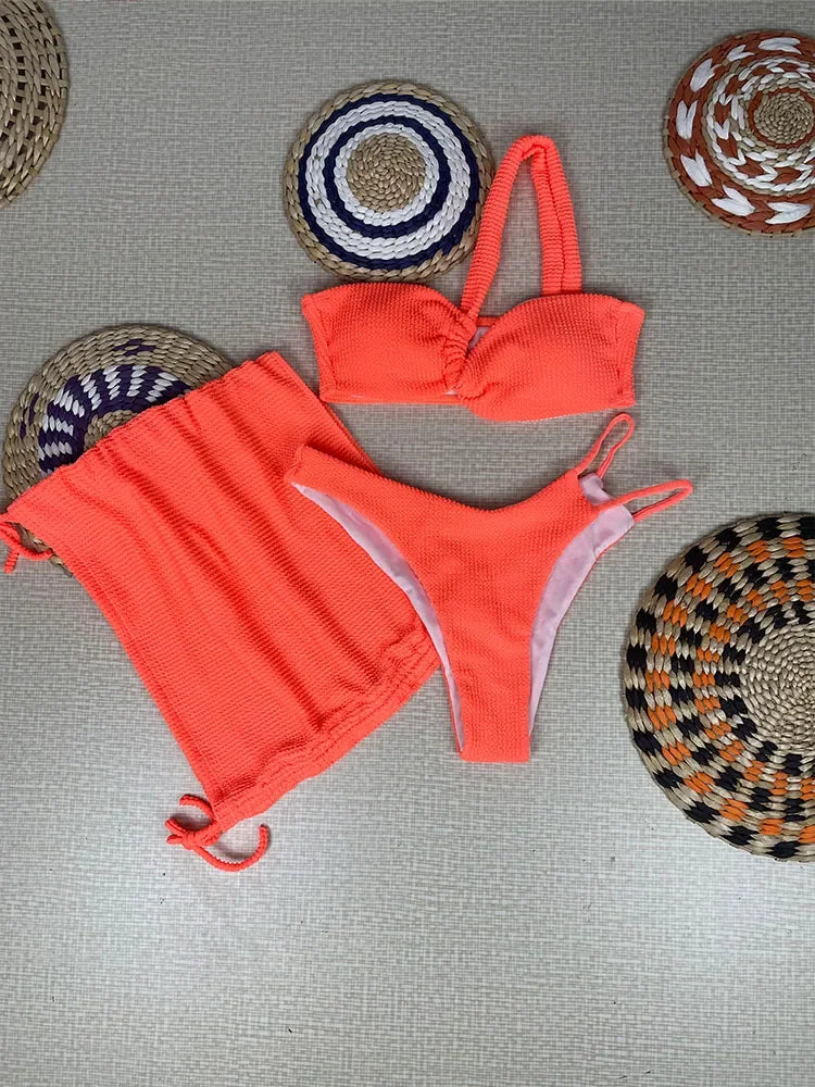 Vibrant Orange Three-Piece Swimwear Set with Ruched Bralette and Cover-Up Skirt