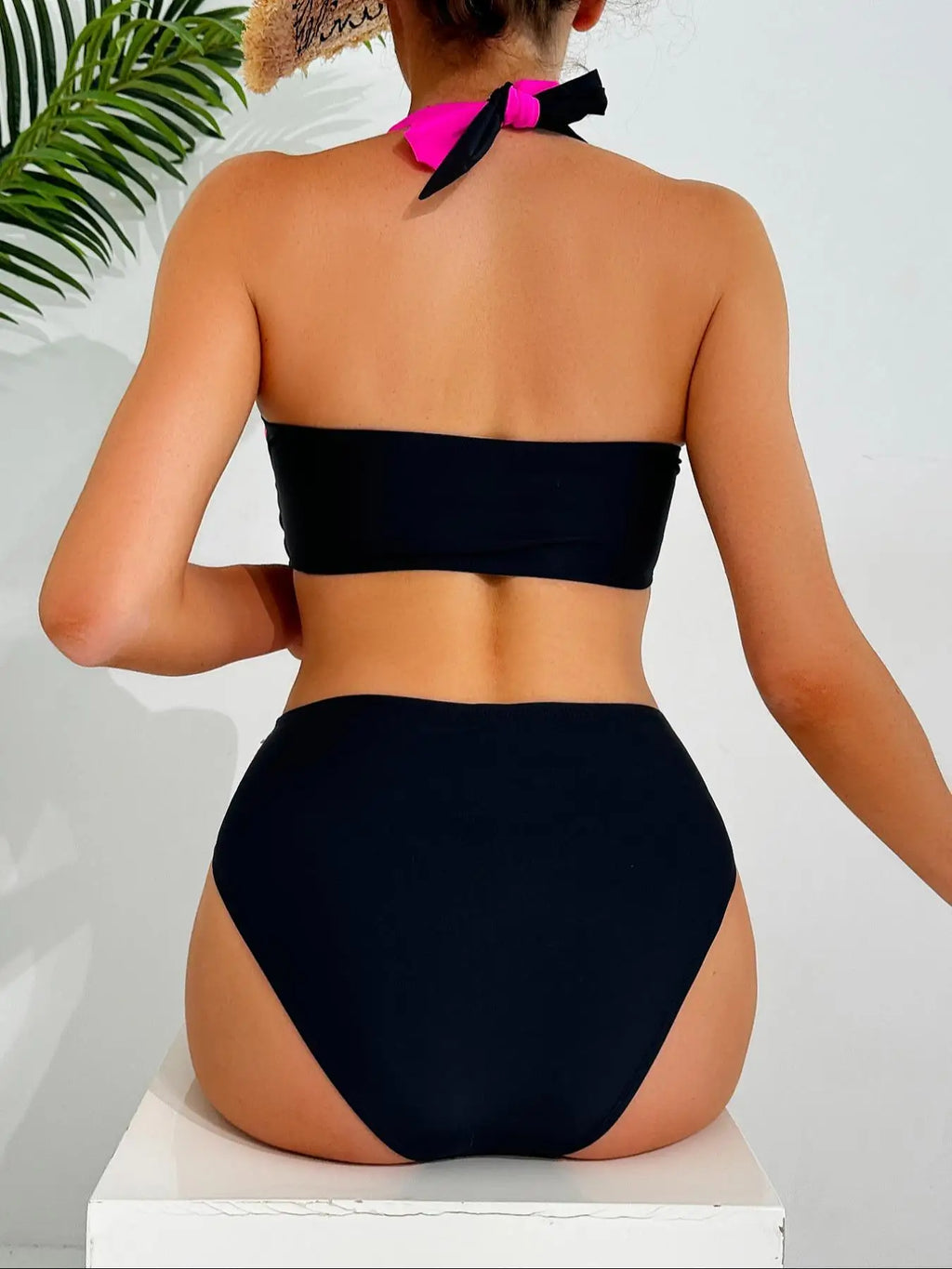 Black and Neon Pink Colorblock Two-Piece Bikini Set with Criss-Cross Halter Top and High-Waisted Contrast Bottom