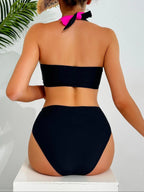 Black and Neon Pink Colorblock Two-Piece Bikini Set with Criss-Cross Halter Top and High-Waisted Contrast Bottom