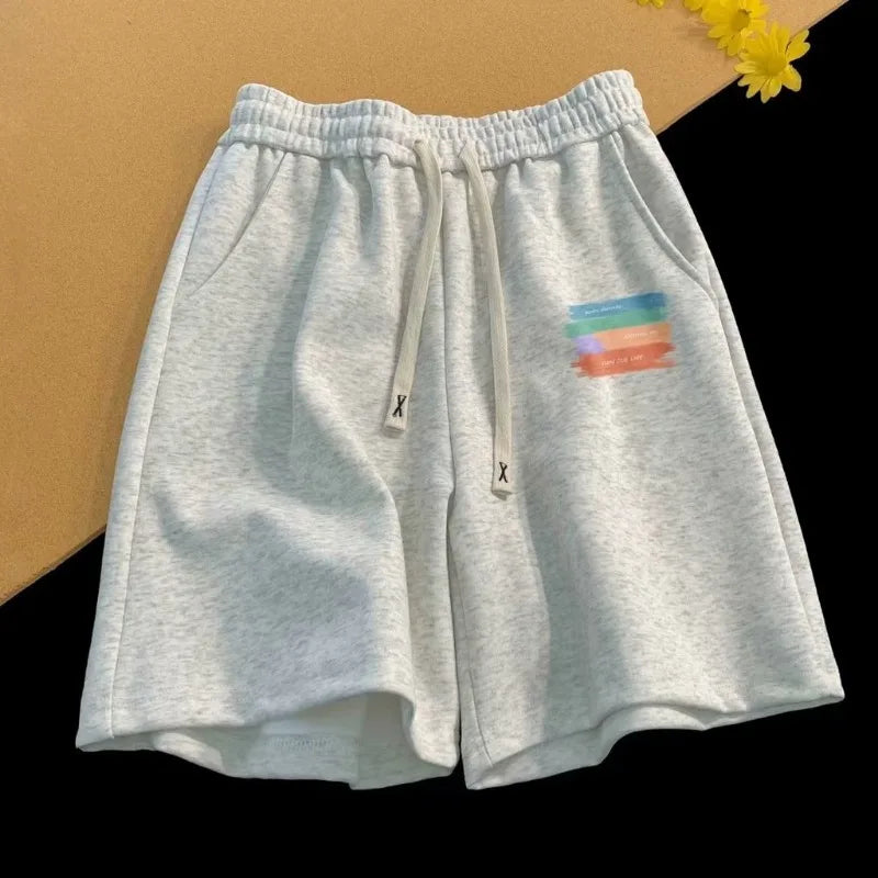 Relaxed Fit Drawstring Streetwear Shorts with Graphic Detail and Athletic Silhouette