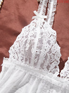 White Sheer Lace Camisole and Thong Lingerie Set with Delicate Straps, Floral Lace Detailing and Split-Hem Silhouette