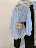 Classic Striped Button-Down Shirt with Subtle Chest Graphic and Relaxed Fit