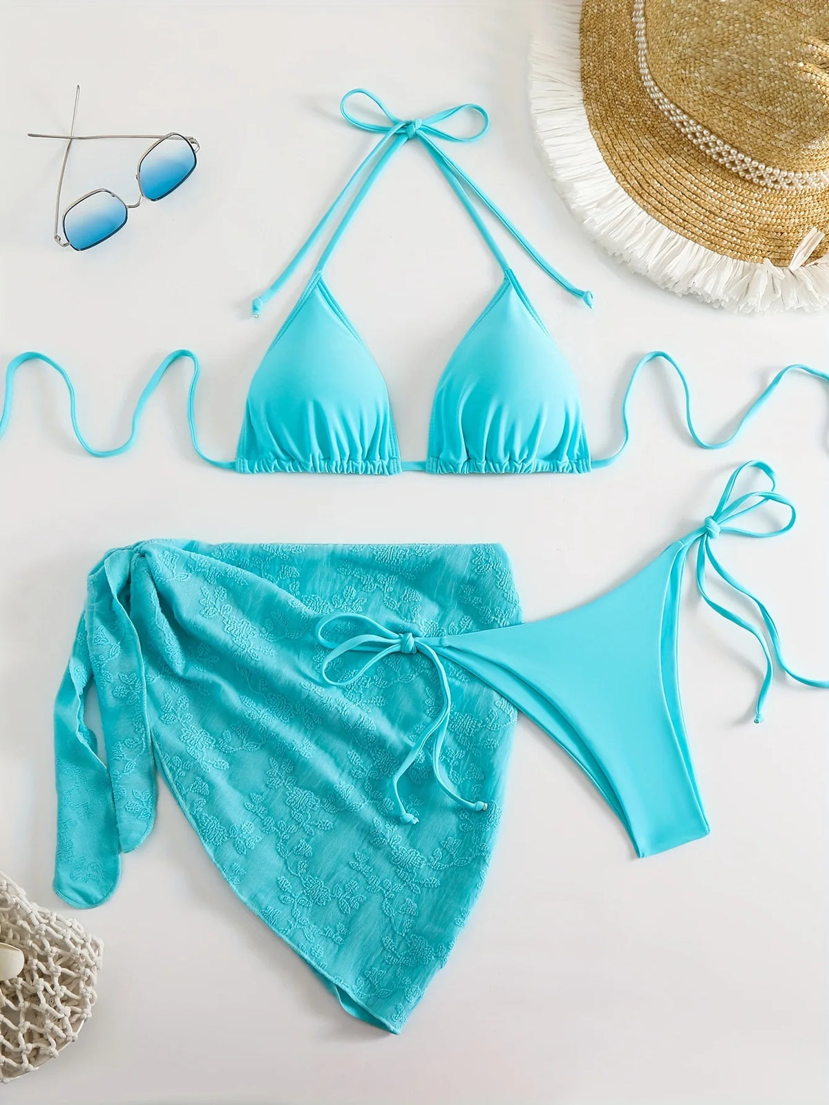 Bright Turquoise Three-Piece String Bikini Set with Matching Tie Sarong
