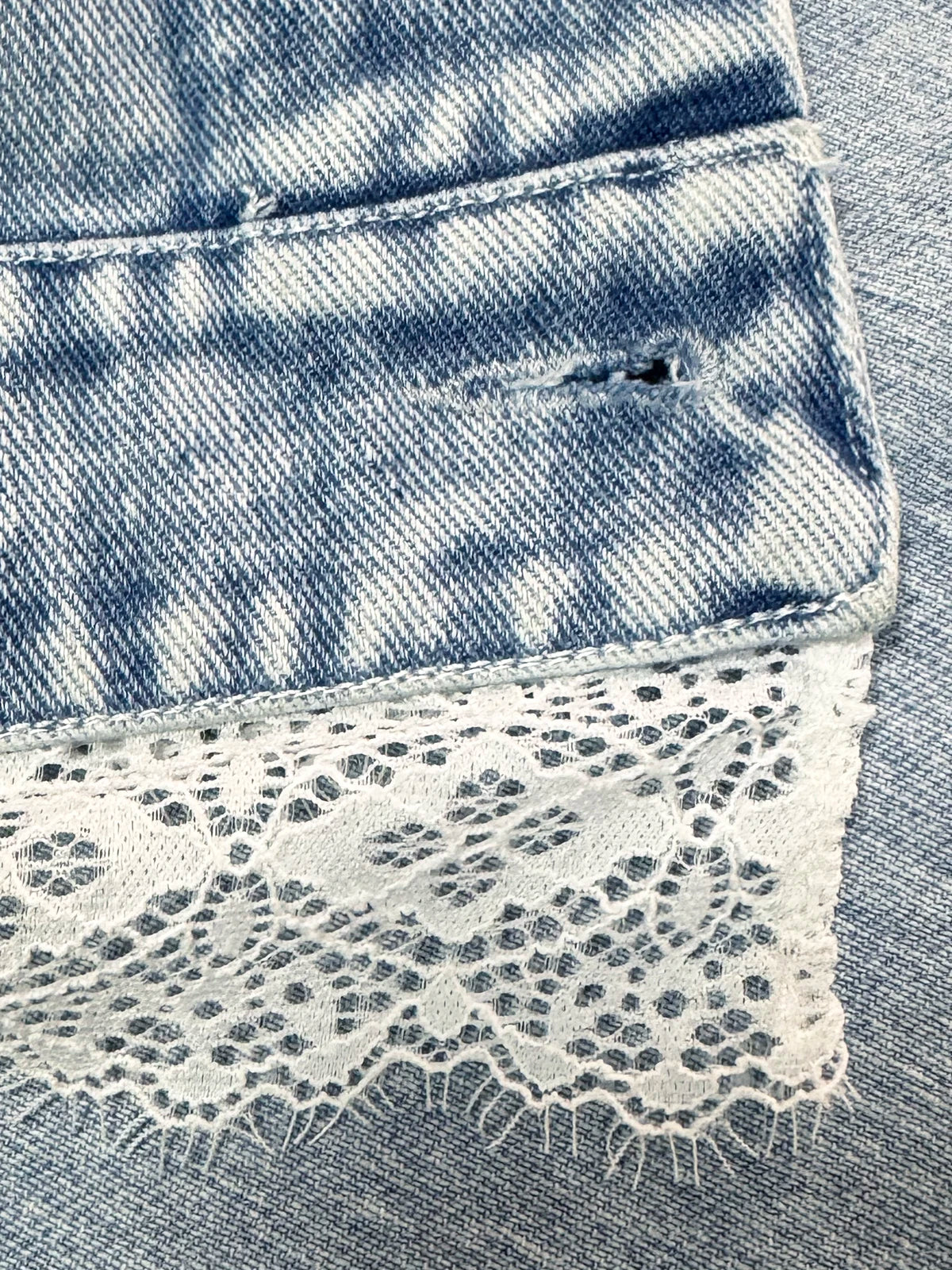 Cropped Denim Jacket with Decorative Hem Detail and Casual Streetwear Styling