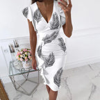 Form-Fitting Black Floral Midi Dress with Flutter Sleeves and Ruched Side Detailing