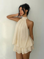 Elegant Cream Halter-Neck Mini Dress with Fluid Draped Silhouette