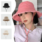 Minimalist Bucket Hat with Soft Brim and Decorative Tassel Detail for Everyday Outdoor Style