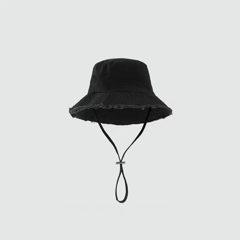 Minimalist Bucket Hat with Soft Brim and Decorative Tassel Detail for Everyday Outdoor Style