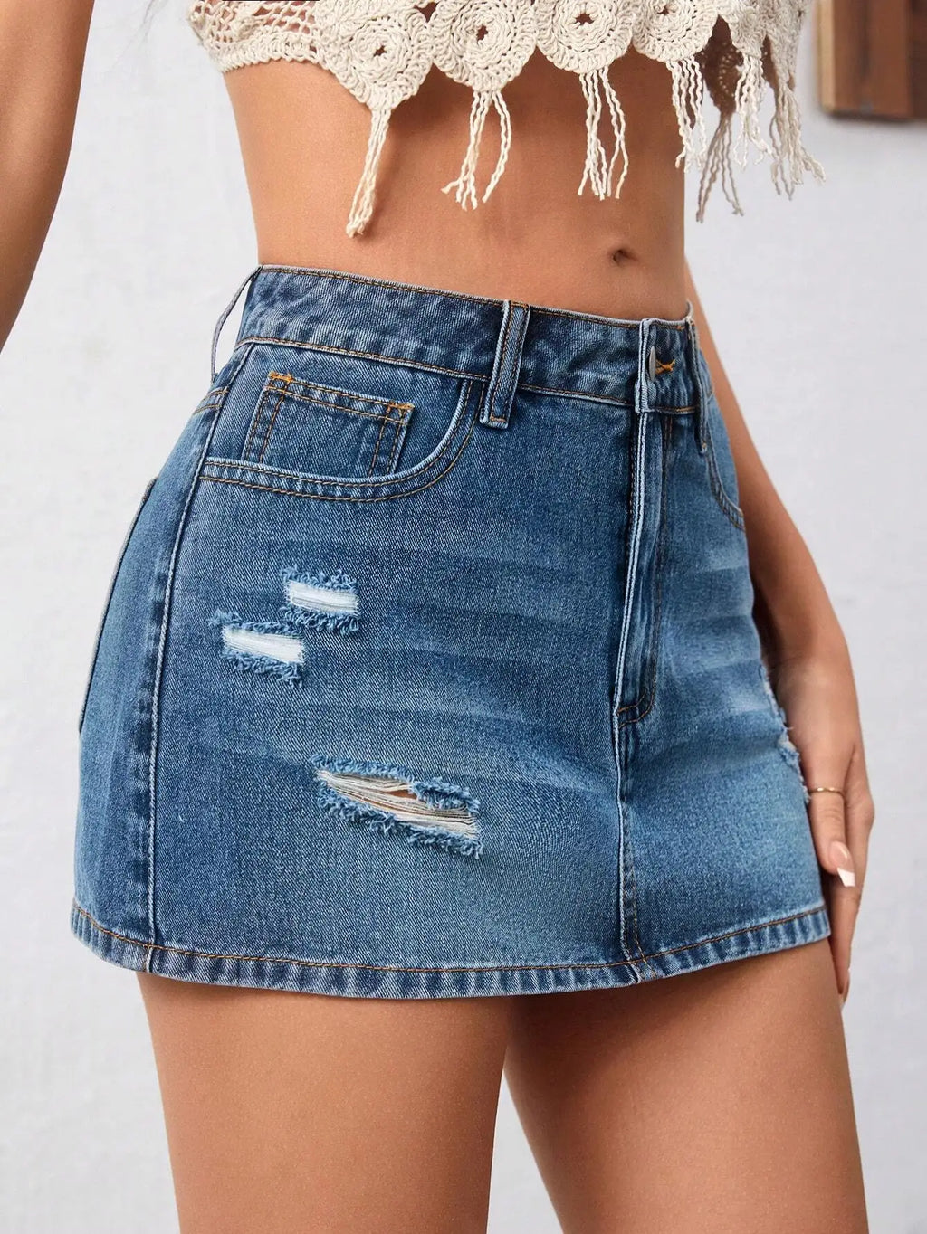 Distressed Low Rise Denim Mini Skirt with Ripped Streetwear Details