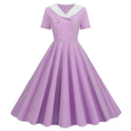 Vintage-Inspired Yellow Swing Dress with Contrast Collar and Decorative Buttons