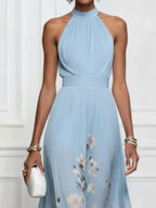 Ethereal Light Blue Halter Maxi Dress with Flowing Floral Print Hem