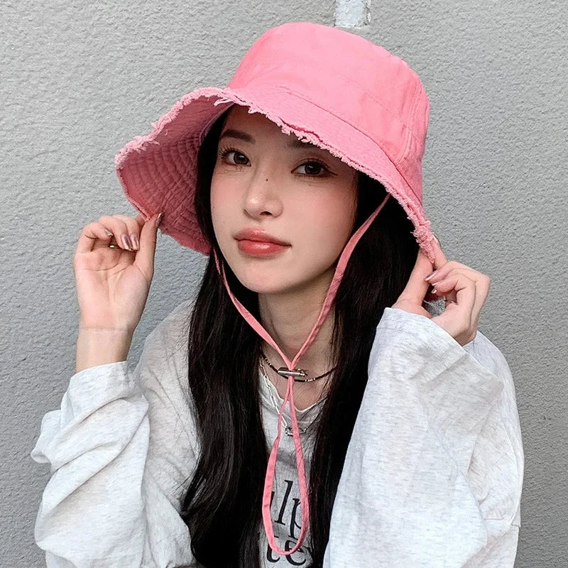Minimalist Bucket Hat with Soft Brim and Decorative Tassel Detail for Everyday Outdoor Style