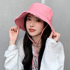Minimalist Bucket Hat with Soft Brim and Decorative Tassel Detail for Everyday Outdoor Style