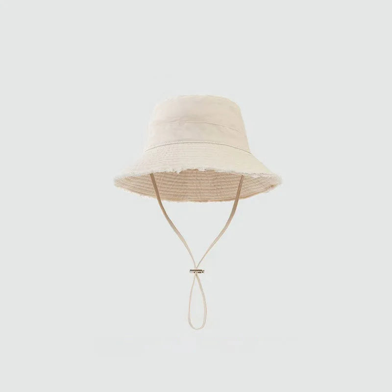 Minimalist Bucket Hat with Soft Brim and Decorative Tassel Detail for Everyday Outdoor Style