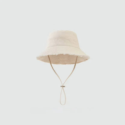 Minimalist Bucket Hat with Soft Brim and Decorative Tassel Detail for Everyday Outdoor Style