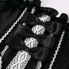 Playful Pink and Black Ruffled Sweetheart Dress with Decorative Bows and Lace Trim