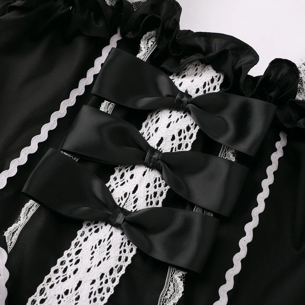 Playful Pink and Black Ruffled Sweetheart Dress with Decorative Bows and Lace Trim