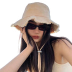 Minimalist Bucket Hat with Soft Brim and Decorative Tassel Detail for Everyday Outdoor Style