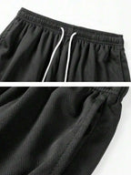 Men's Loose Fit Mesh Basketball Shorts with Elastic Waist and Athletic Everyday Comfort