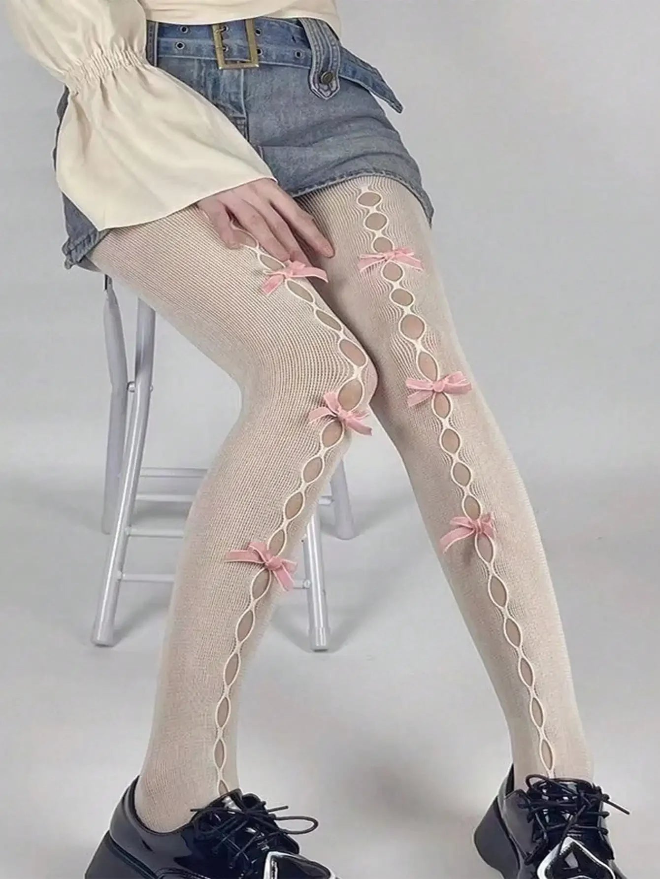 Decorative Bow Fishnet Thigh High Stockings with Open Mesh Pattern for Alternative Fashion Styling