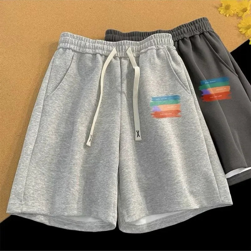 Relaxed Fit Drawstring Streetwear Shorts with Graphic Detail and Athletic Silhouette