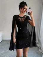 Glamorous Black Glitter Mini Dress with Sheer Lace Yoke and Flowing Cape Sleeves