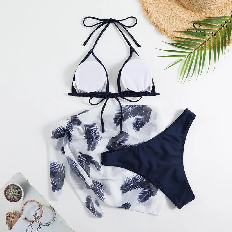 Emerald Green Three-Piece Bikini Set with Halter Triangle Top, Matching Bikini Bottom and Printed Beach Wrap