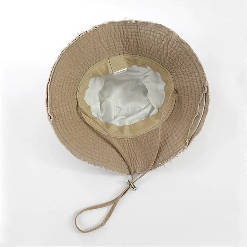 Minimalist Bucket Hat with Soft Brim and Decorative Tassel Detail for Everyday Outdoor Style