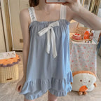 Soft Pink Two-Piece Women's Pajama Set with Bow-Tie Front, Sleeveless Cami Top and Coordinating Ruffle-Hem Shorts