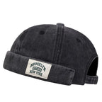 Minimalist Folded Cuffed Beanie with Woven Patch Detail for Contemporary Streetwear Fashion