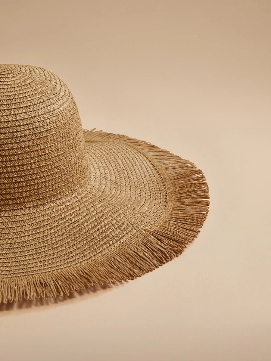Oversized Woven Straw Sun Hat with Fringe Trim for Beach Travel and Resort Styling