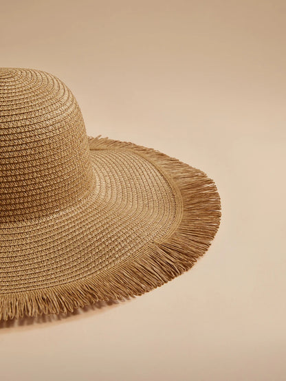 Oversized Woven Straw Sun Hat with Fringe Trim for Beach Travel and Resort Styling
