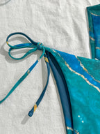 Vibrant Blue Marble Print String Bikini Set with Sheer Mesh Wrap Skirt