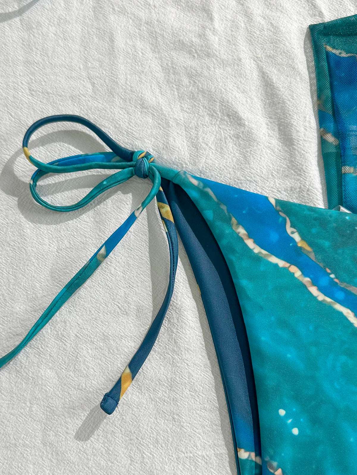 Vibrant Blue Marble Print String Bikini Set with Sheer Mesh Wrap Skirt