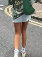 Asymmetrical Zip Distressed Denim Mini Skirt with Frayed Hem Detail