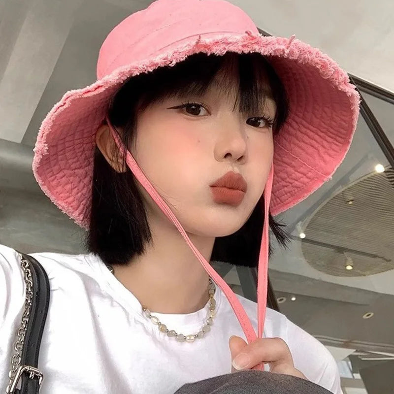 Minimalist Bucket Hat with Soft Brim and Decorative Tassel Detail for Everyday Outdoor Style