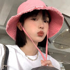 Minimalist Bucket Hat with Soft Brim and Decorative Tassel Detail for Everyday Outdoor Style